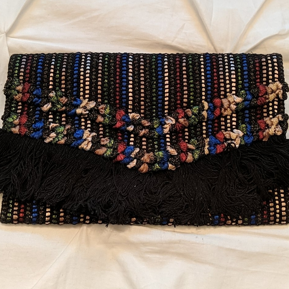 Multi color clutch with fringe
